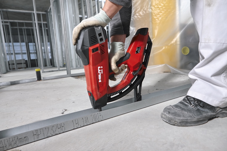 MAN USING HILTI TOOL