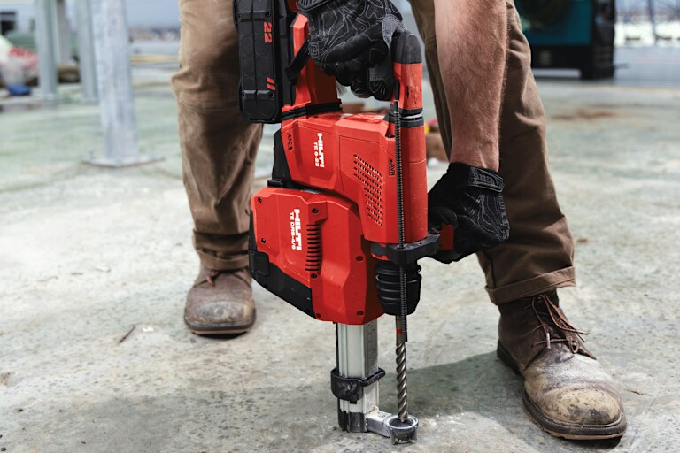 MAN USING HILTI DRILL