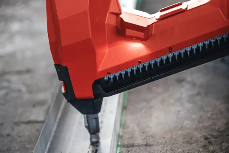 Worker using BX 4-22 to install bottom track.
