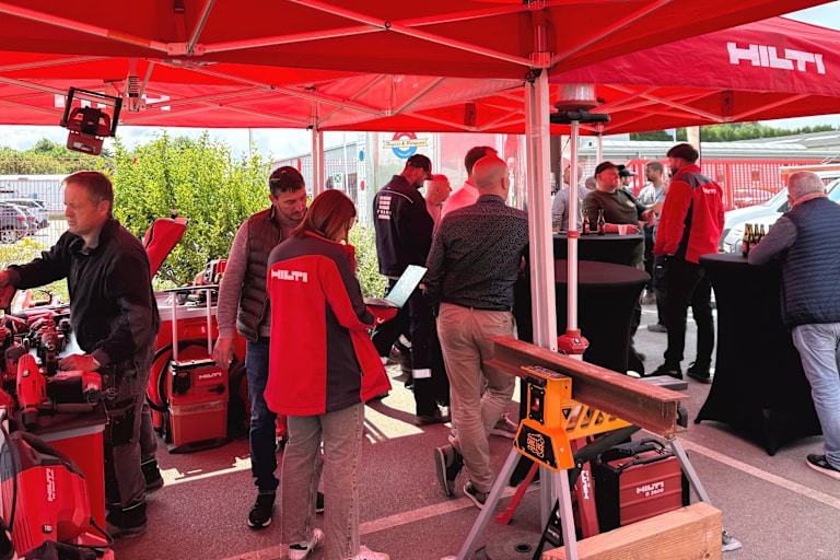 Hilti Store employee showing information on a tablet