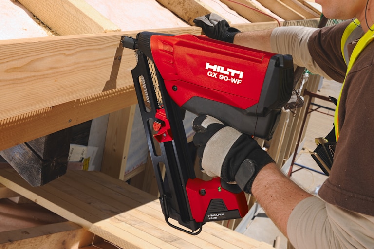 MAN USING HILTI TOOL