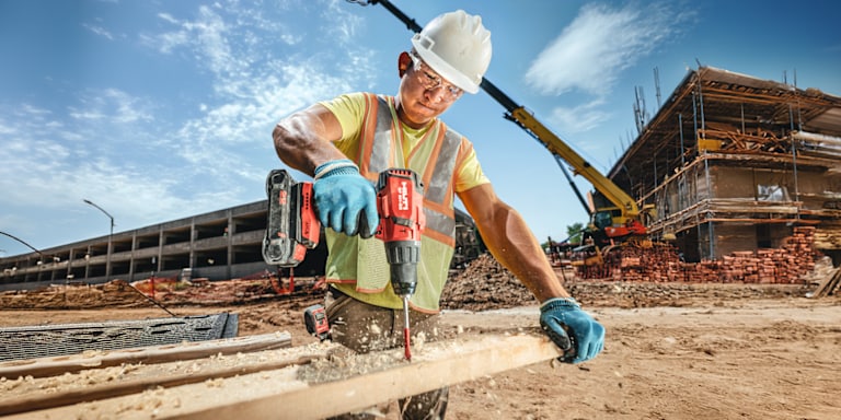 MAN USING SF 4H DRILL DRIVER
