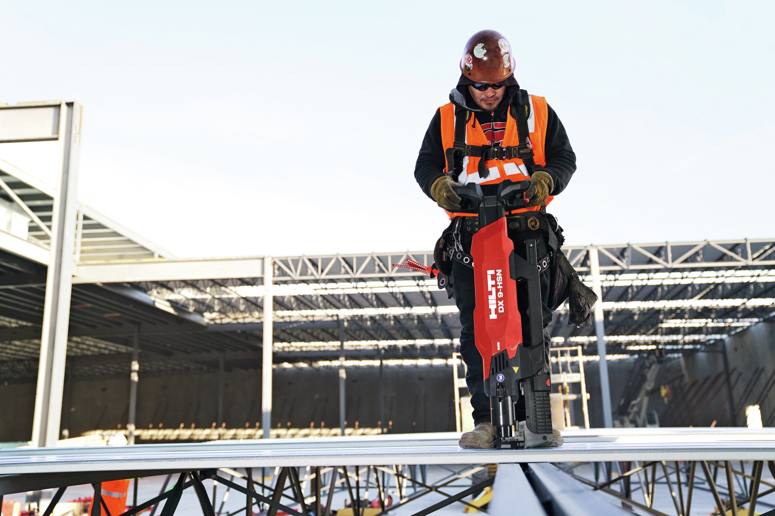MAN USING A HILTI DX TOOL