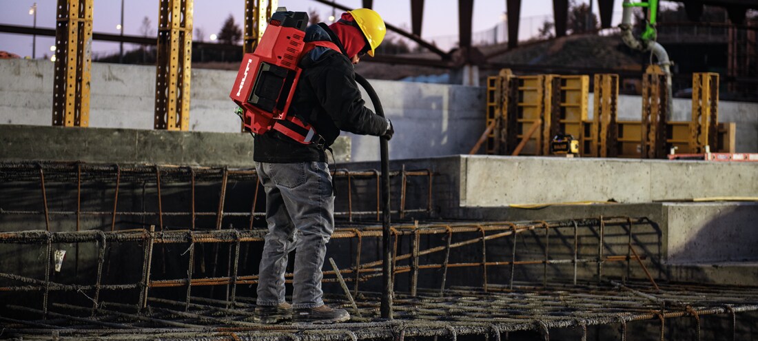 MAN USING CONCRETE POKER