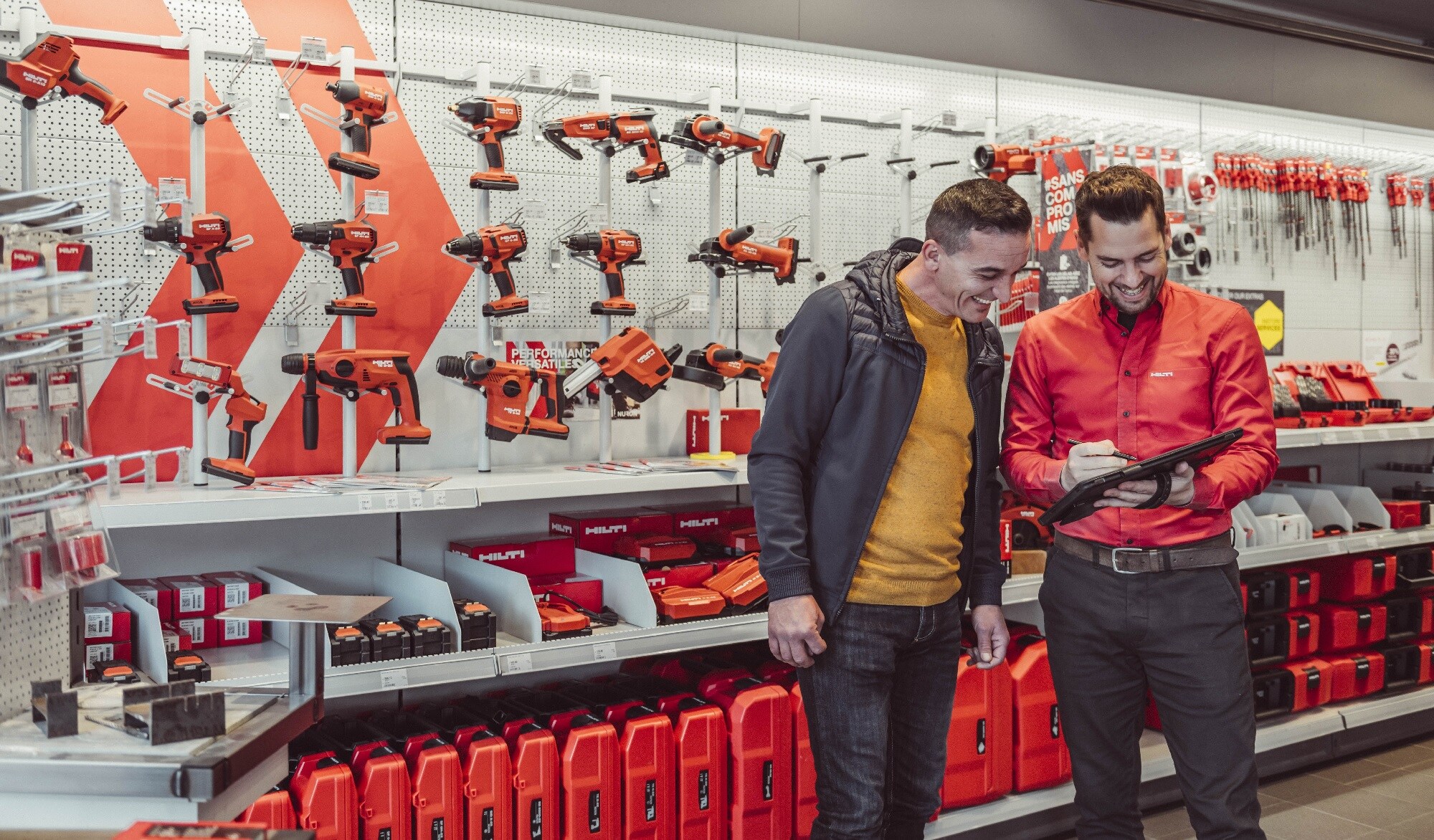 Hilti Store employee showing information on a tablet