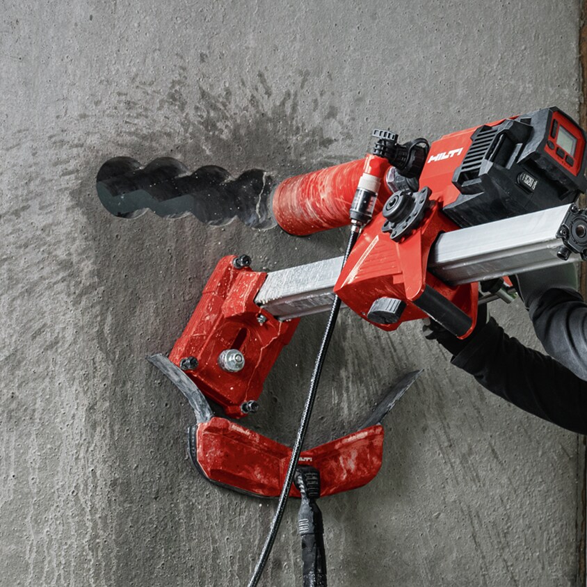 person using hilti core drill