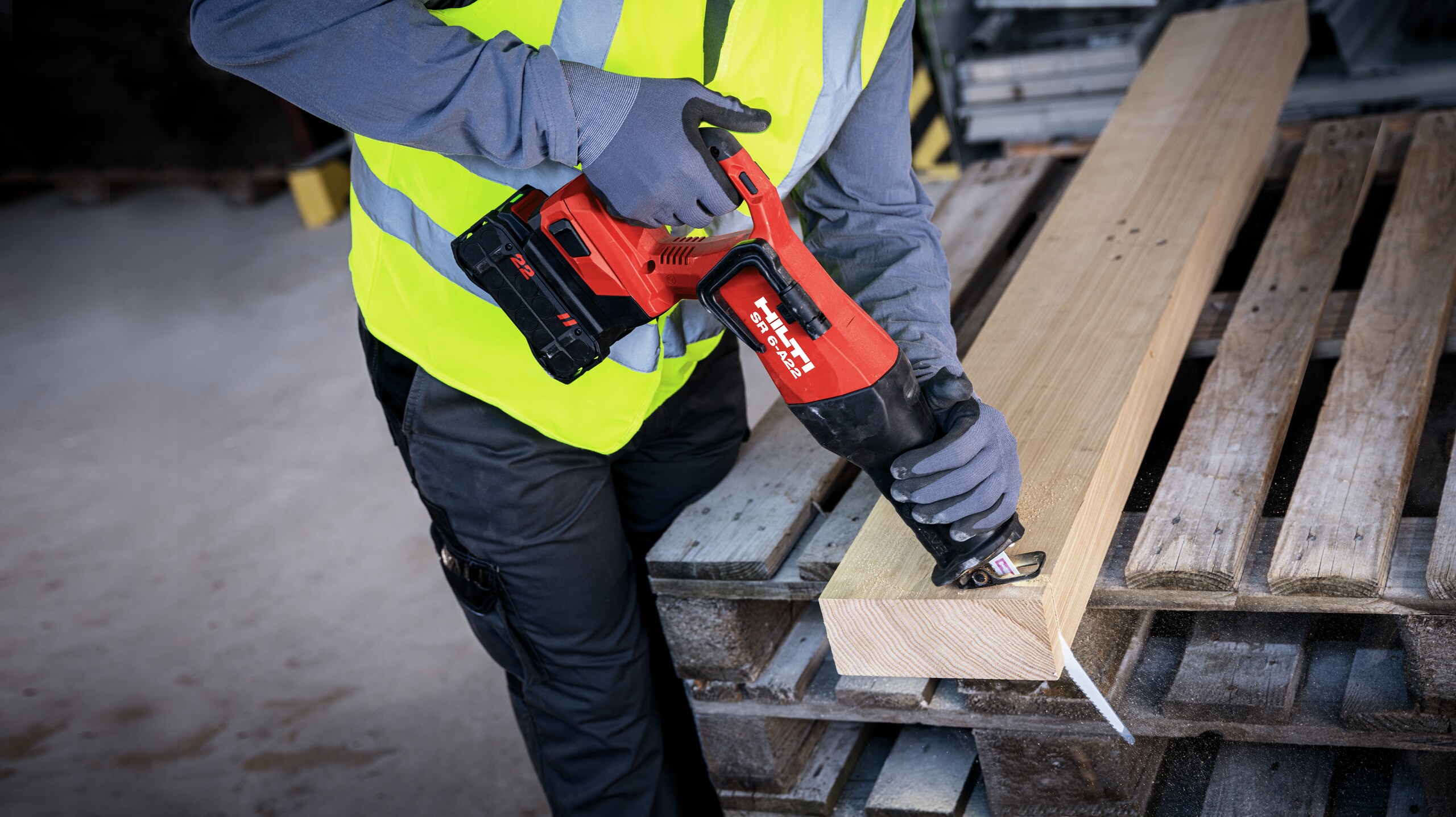 worker cutting wood