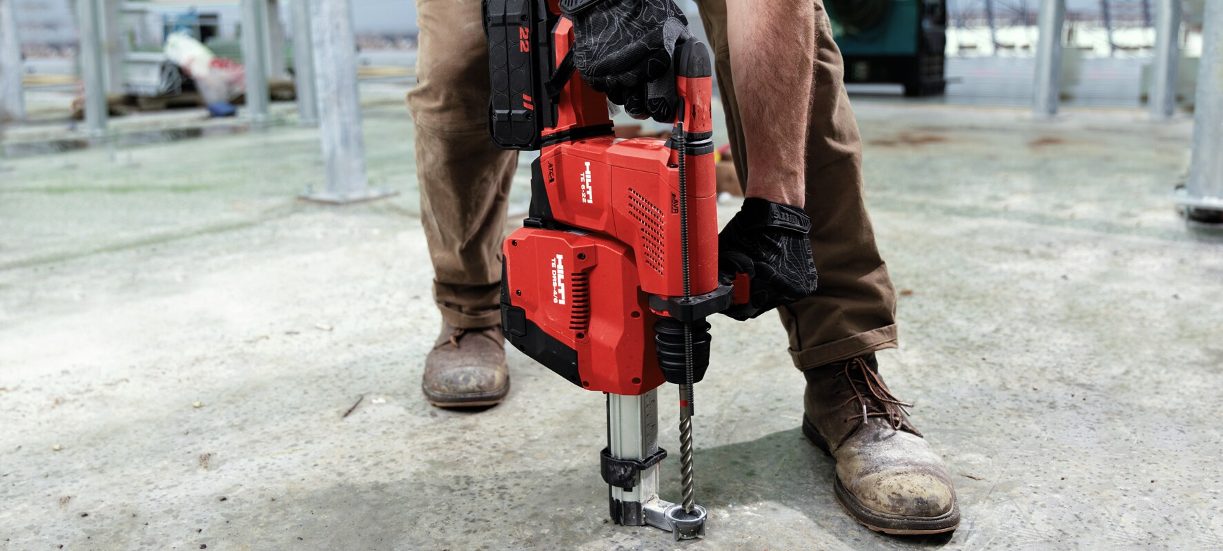 MAN USING HILTI DRILL
