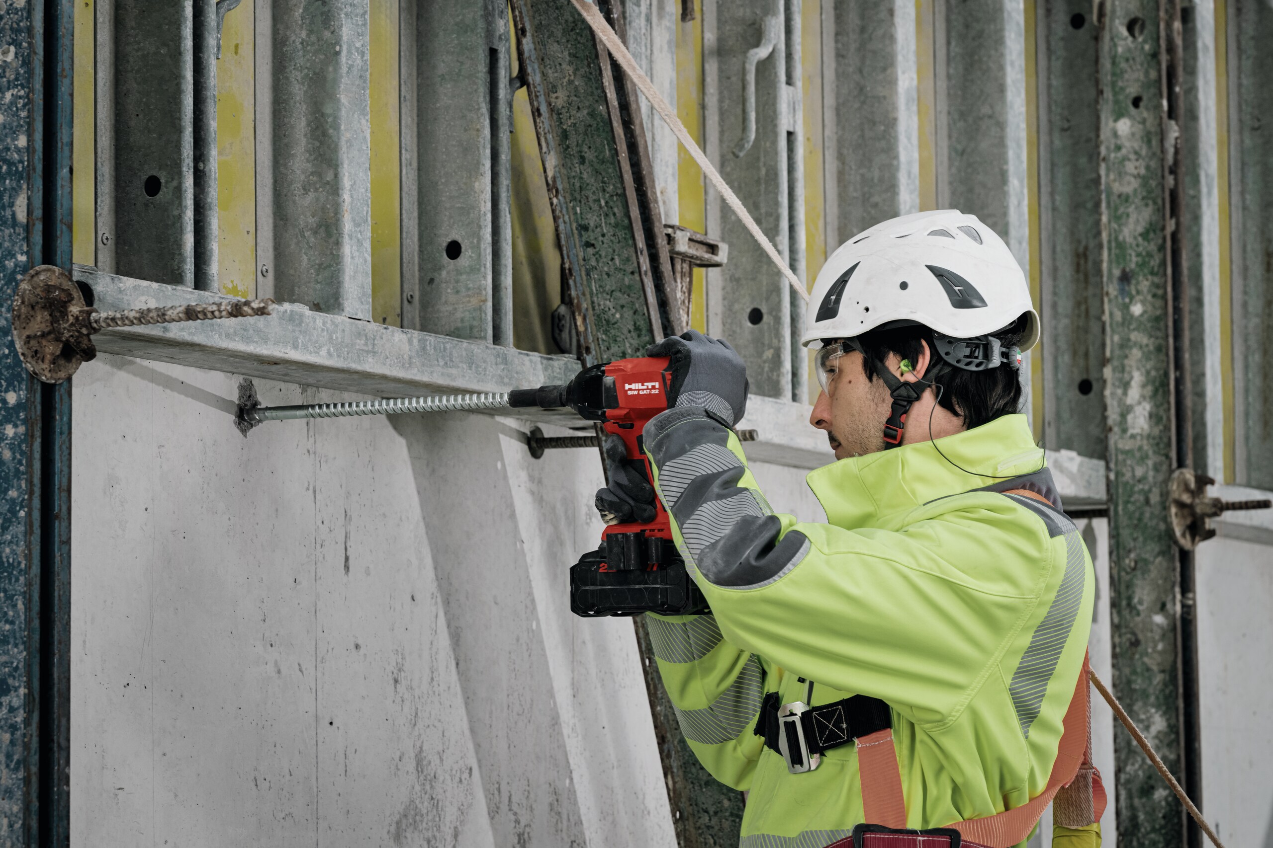 MAN USING HILTI DRILL