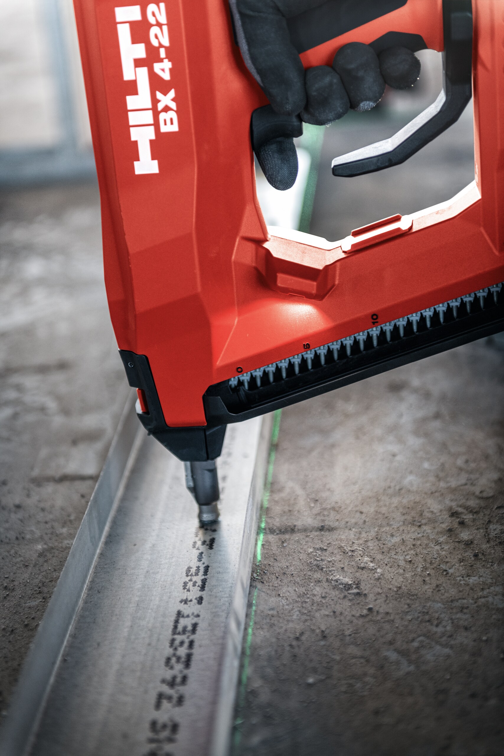 Worker using BX 4-22 to install bottom track.