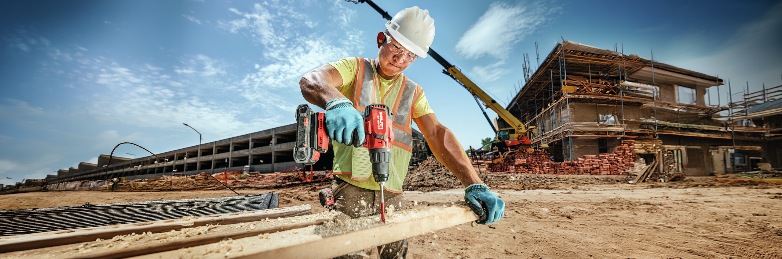 worker using Hilti drill