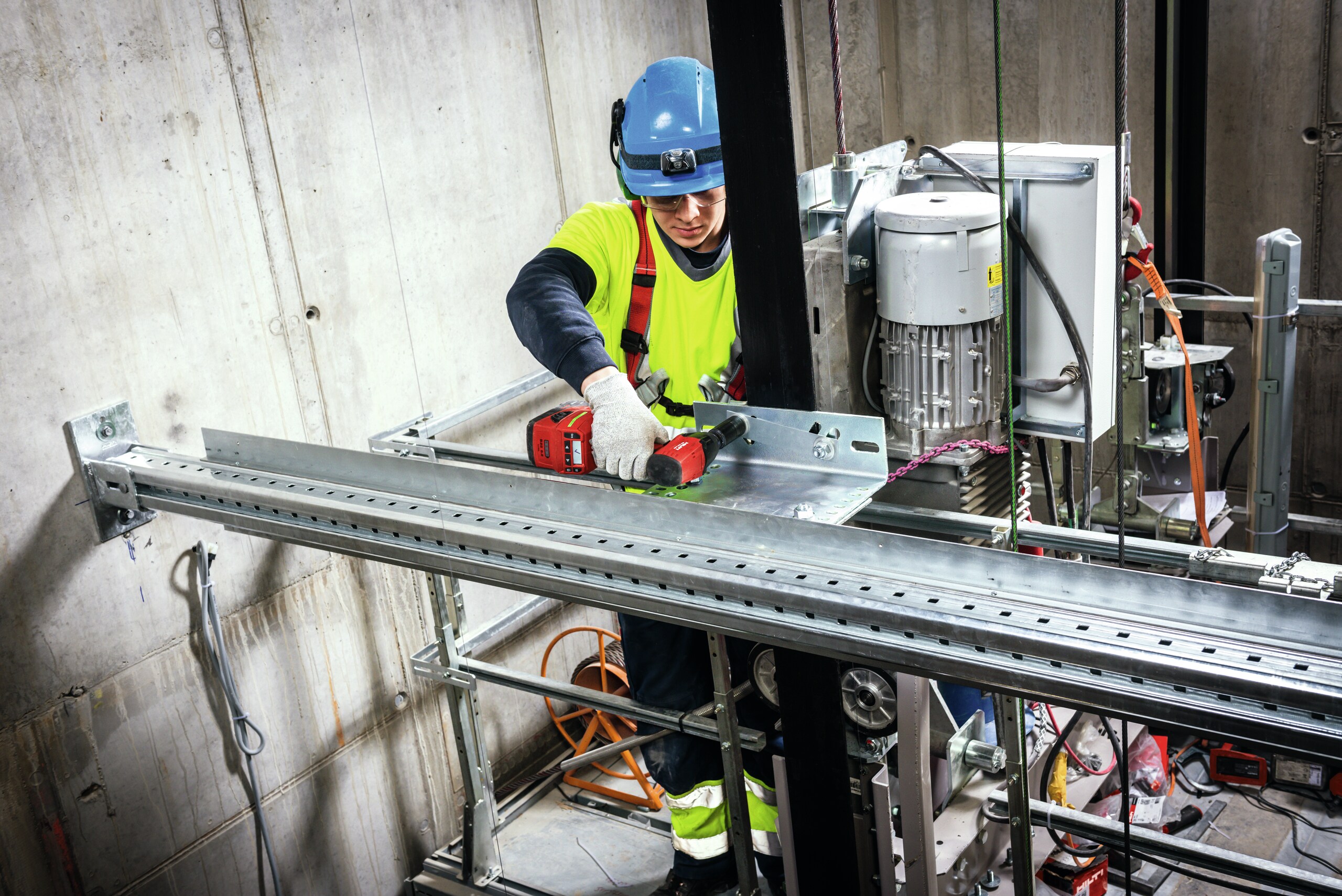 person tightening a bolt