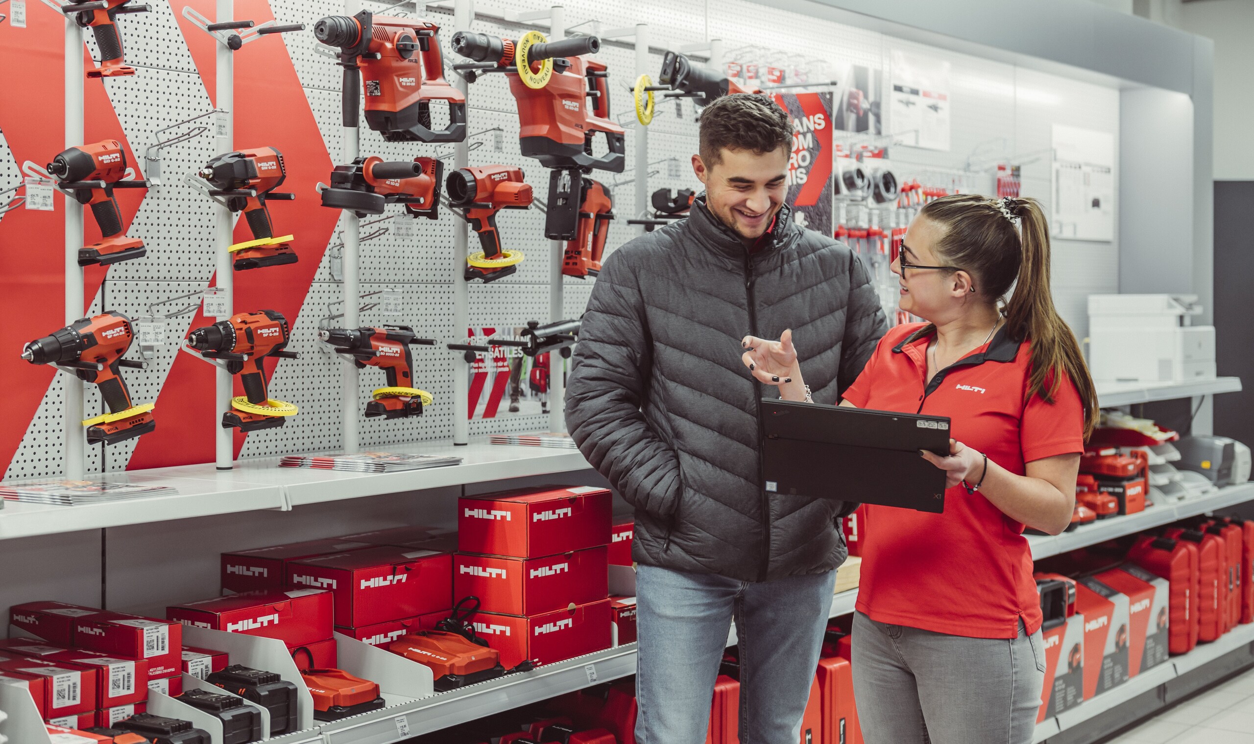 Hilti Store employee showing information on a tablet
